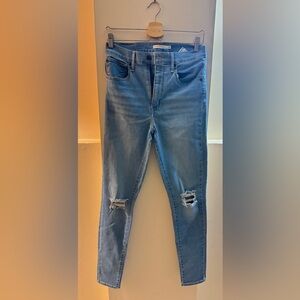 Levi's Light Blue Distressed Skinny Jeans.